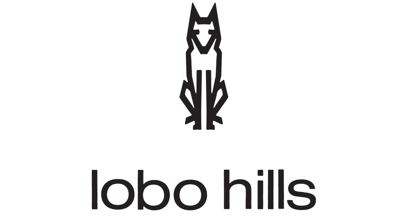 Lobo Hills Wine Co. logo featuring a stylized wolf and modern typography, representing premium wine brand and vineyard in Was.